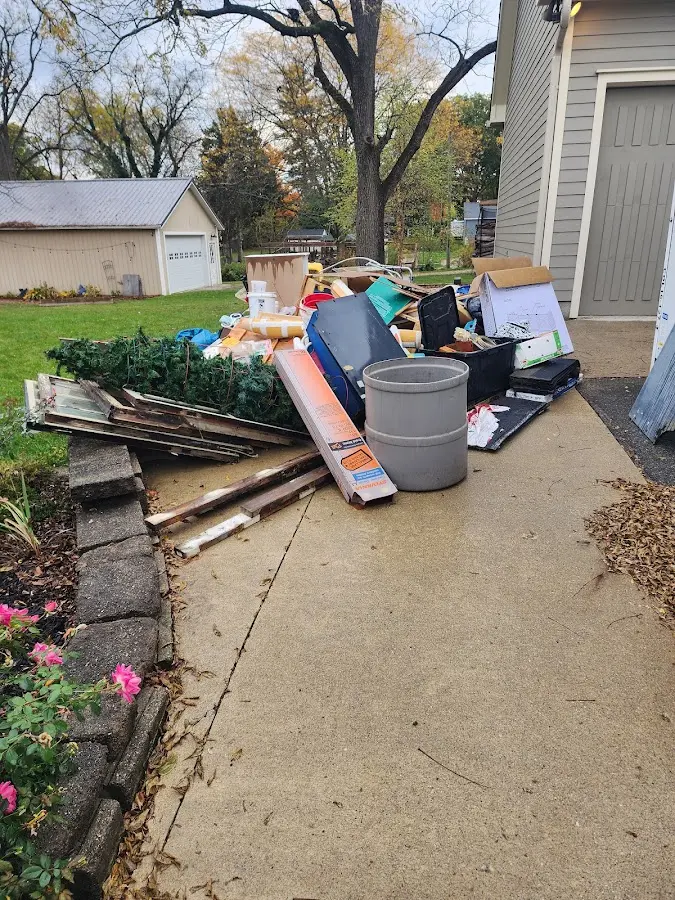 Dumpster being loaded with debris for 12 Yard Dumpster Rental in Buckingham